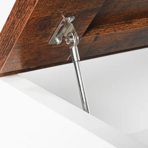 Close-up of a wooden lid with metal hinge and support strut, modern furniture detail.