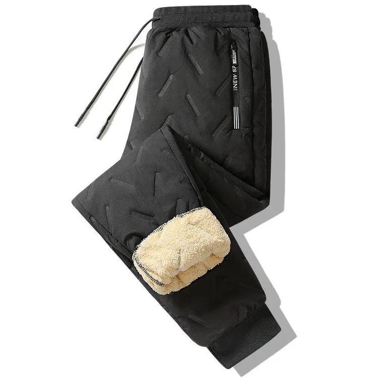 Black quilted jogger pants with beige fleece lining, elastic waist, and drawstring fit