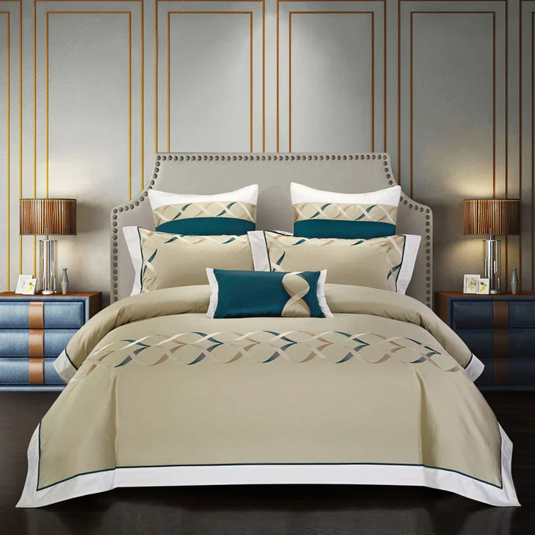 Beige and teal geometric bedding set with decorative pillows in a modern bedroom