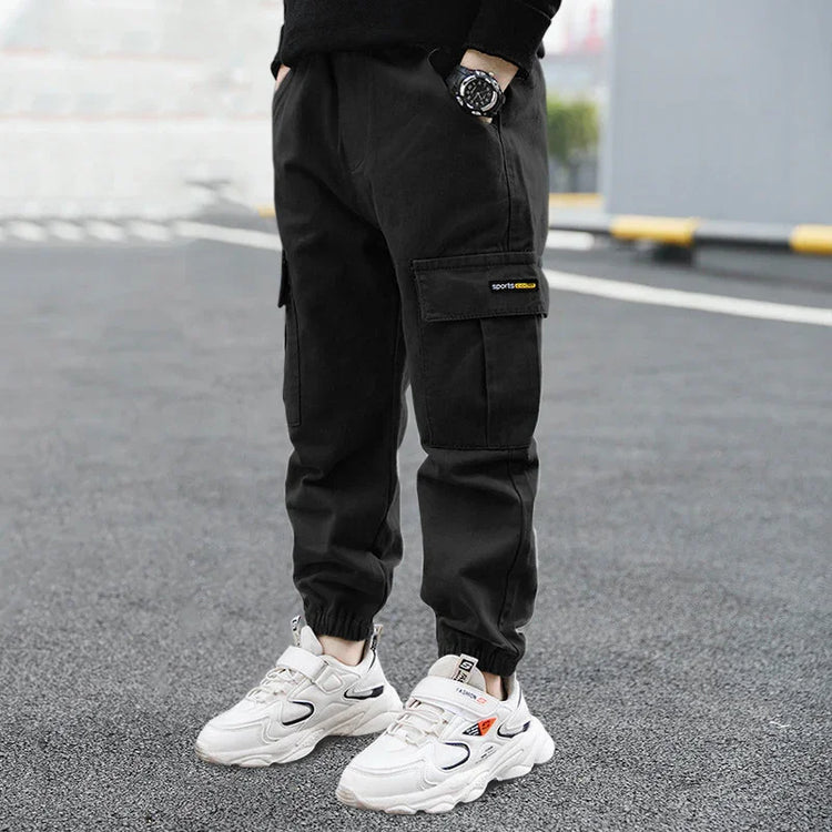 Black cargo jogger pants with elastic cuffs, loose fit, streetwear style, side pockets