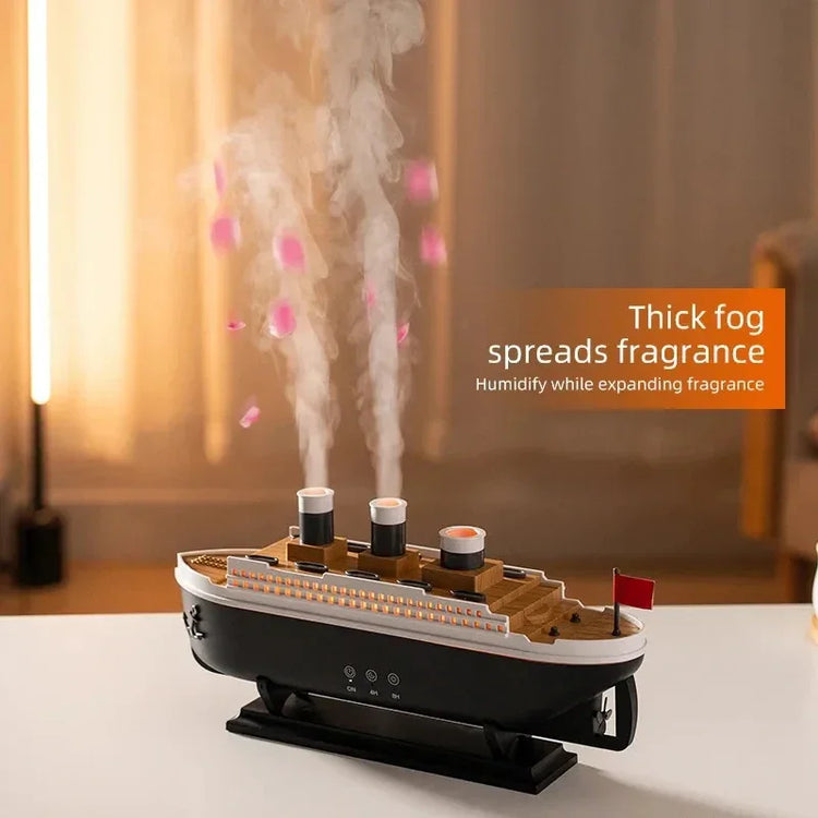 Ship-shaped humidifier diffuser releasing thick mist with warm light accents on a table.