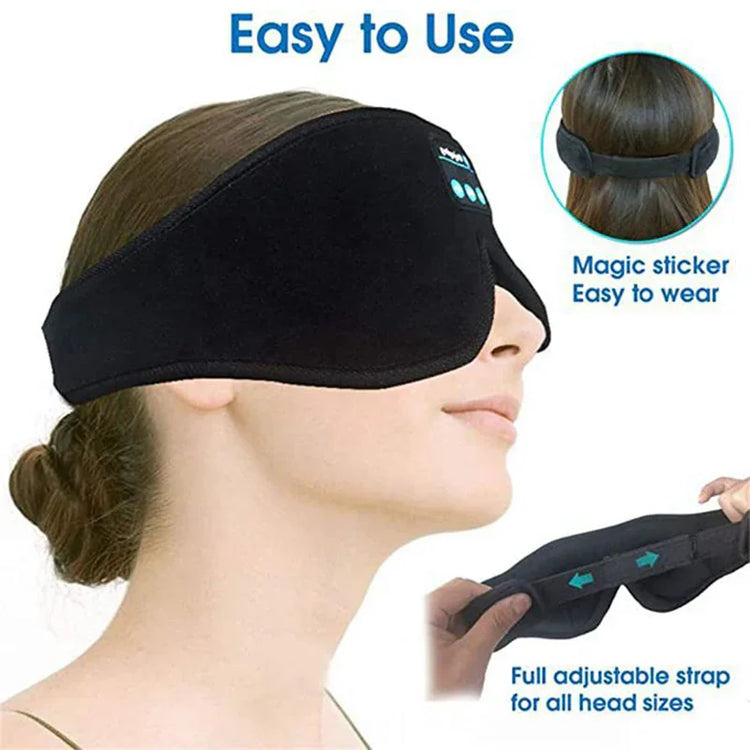 Black fleece sleep mask with adjustable strap, ergonomic fit, and velcro closure.