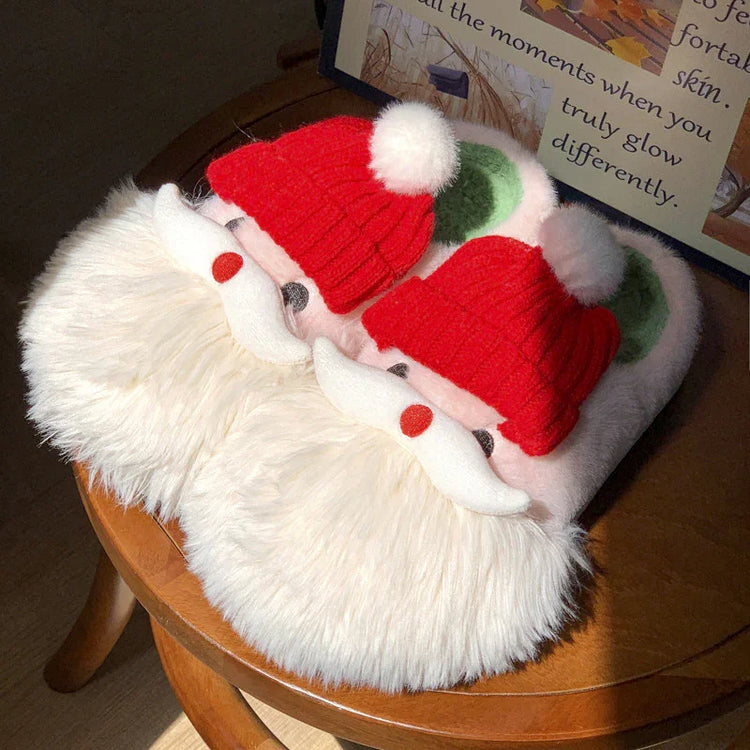 Fuzzy novelty slippers with Santa Claus design, featuring red knit hats and white faux fur