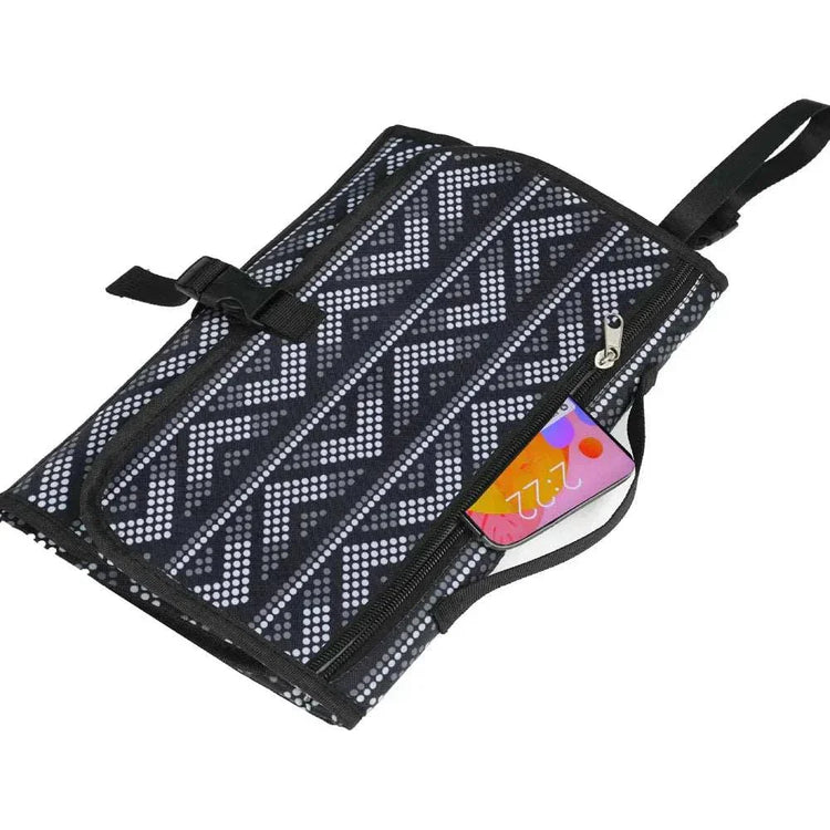 Black and white geometric patterned fabric pouch with zip pocket and adjustable strap