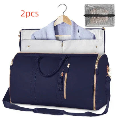 Navy blue duffel garment bag with gold zippers, hanger slot, and matching accessory pouch