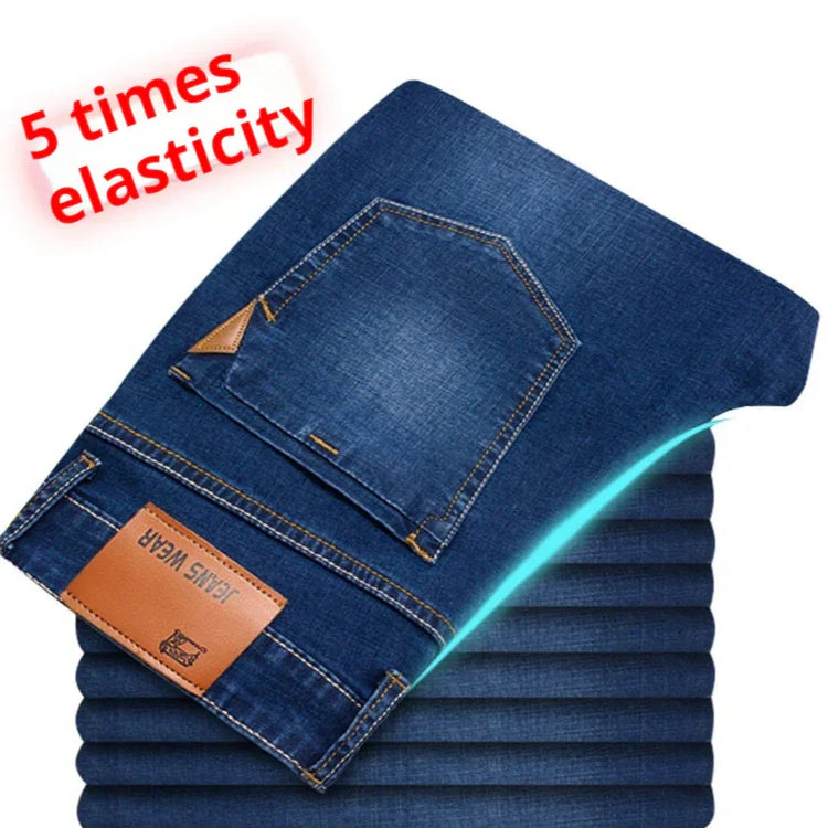 Dark blue stretch denim jeans, slim fit, high elasticity, with back pocket and leather patch.