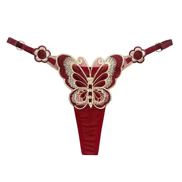 Red lace thong with butterfly embroidery, floral side accents, and adjustable straps
