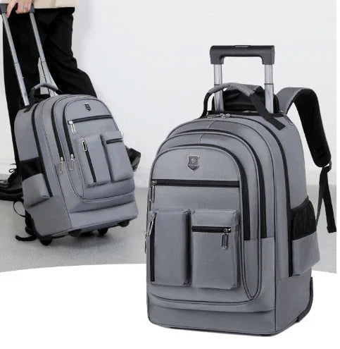 Gray rolling backpack with multiple zippered compartments, durable fabric, adjustable straps, casual fit