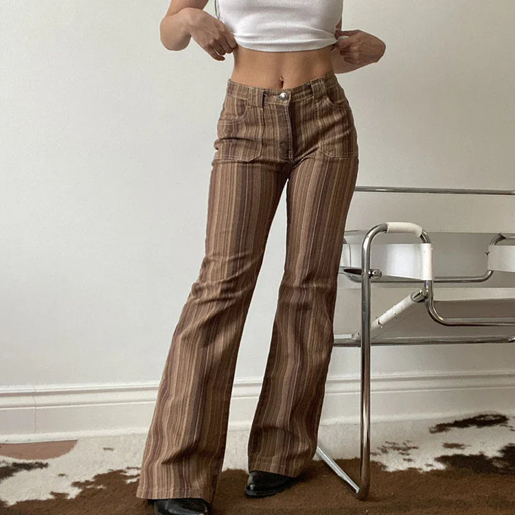 Brown striped flared pants with high waist and fitted cut, paired with white crop top