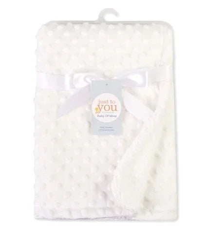Soft white minky dot textured blanket with satin trim, plush and cozy material, folded display
