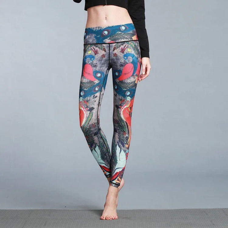 Woman wearing colorful high-waisted leggings with bird and feather print, slim fit