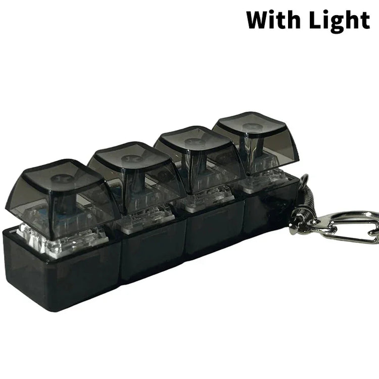 Mini black mechanical keychain with four translucent keys and LED light feature