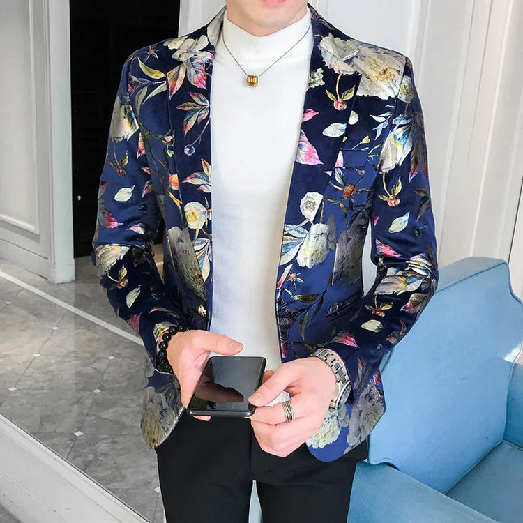 Man wearing a slim fit navy floral blazer over a white turtleneck, modern streetwear style