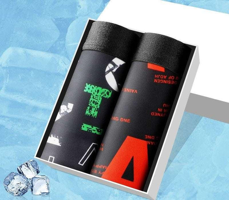 Boxed set of two black streetwear shirts with bold graphic prints, modern fit, synthetic fabric