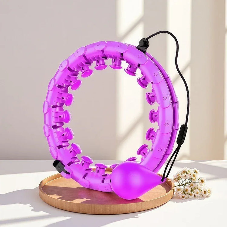 Purple adjustable plastic smart hula hoop with massage nodes and weighted ball on a table