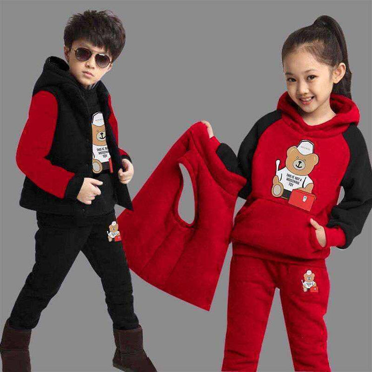 Kids in red and black fleece tracksuits with cartoon bear print, casual relaxed fit.