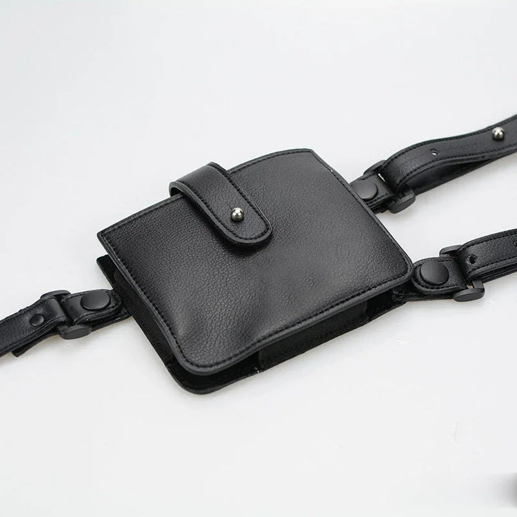 Black faux leather utility belt bag with adjustable straps and snap closure, modern streetwear accessory