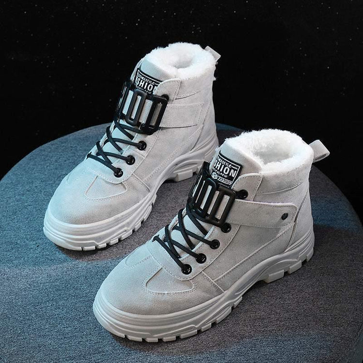 Gray suede high-top boots with chunky white soles, black laces, and plush fur lining