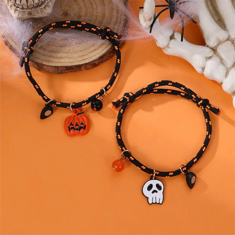 Black and orange braided rope bracelets with Halloween pumpkin and skull charms.