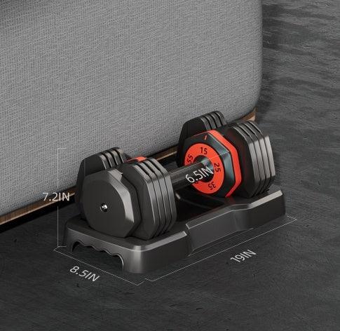 Adjustable black and red dumbbell with weight markings, compact fit under gray sofa