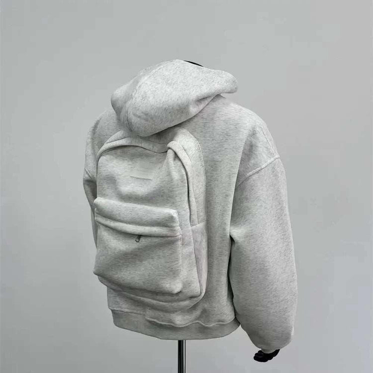 Light gray oversized hoodie with matching backpack, soft fleece material, relaxed fit