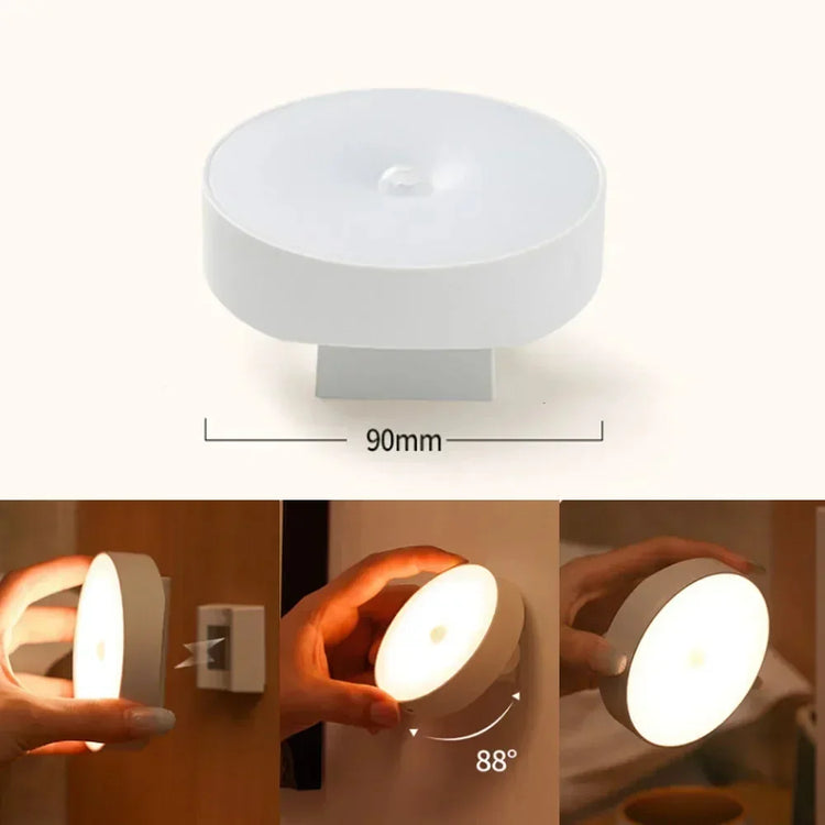 Modern white motion sensor wall night light, 90mm round, warm adjustable LED glow