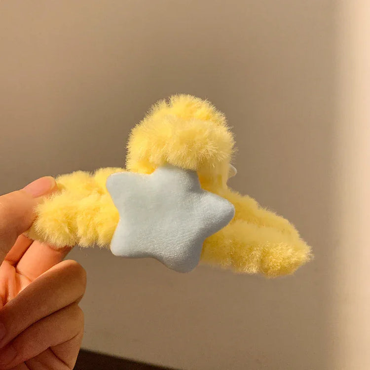 Yellow fluffy hair clip with a soft blue star, cozy material, playful streetwear accessory