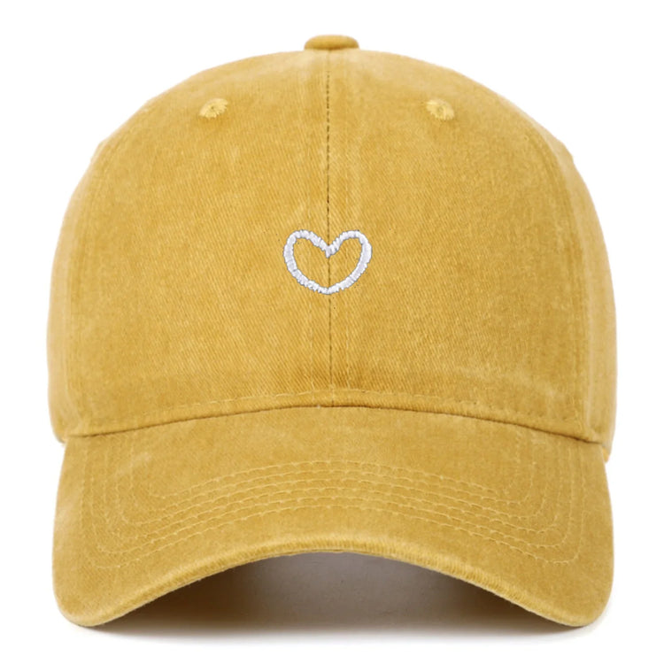 Yellow cotton baseball cap with white embroidered heart, relaxed fit streetwear style