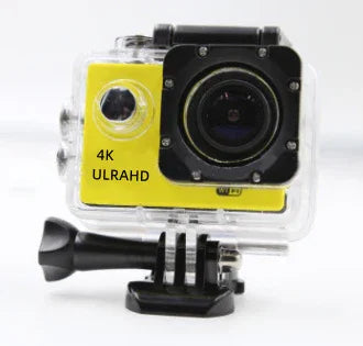 Yellow 4K action camera in clear waterproof case, wide lens, mounted on black base
