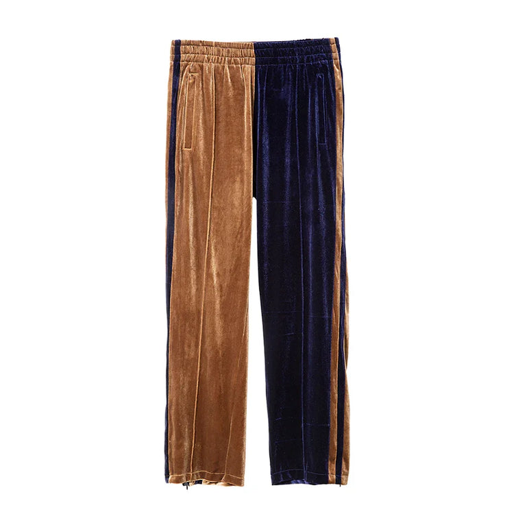 Two-tone velvet track pants in brown and navy with relaxed fit and side pockets