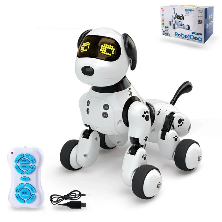 White and black robotic dog toy with LED eyes, remote control, and USB charging cable