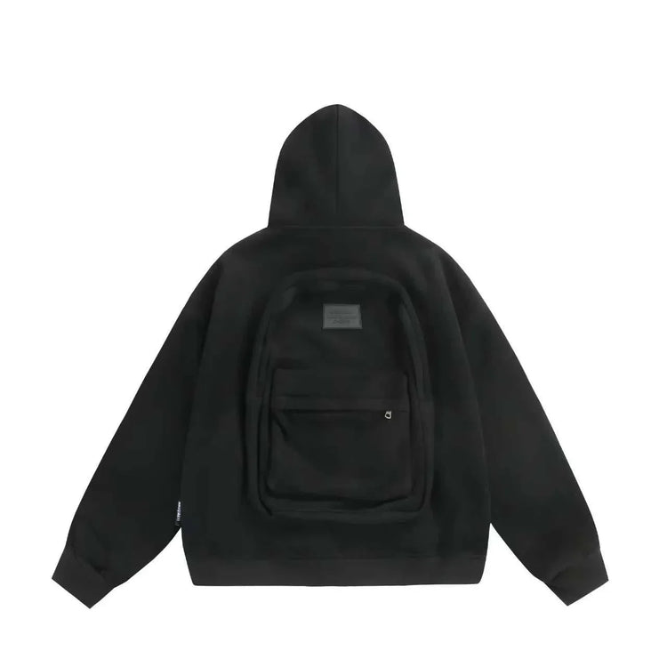 Black oversized hoodie with backpack detail on back, soft material, relaxed streetwear fit