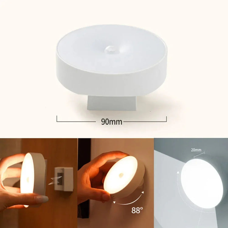Round white motion sensor LED night light, wall-mounted, with adjustable angle feature