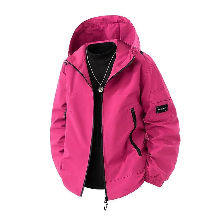 Fuchsia hooded streetwear windbreaker with black zipper and relaxed fit, unisex fashion style