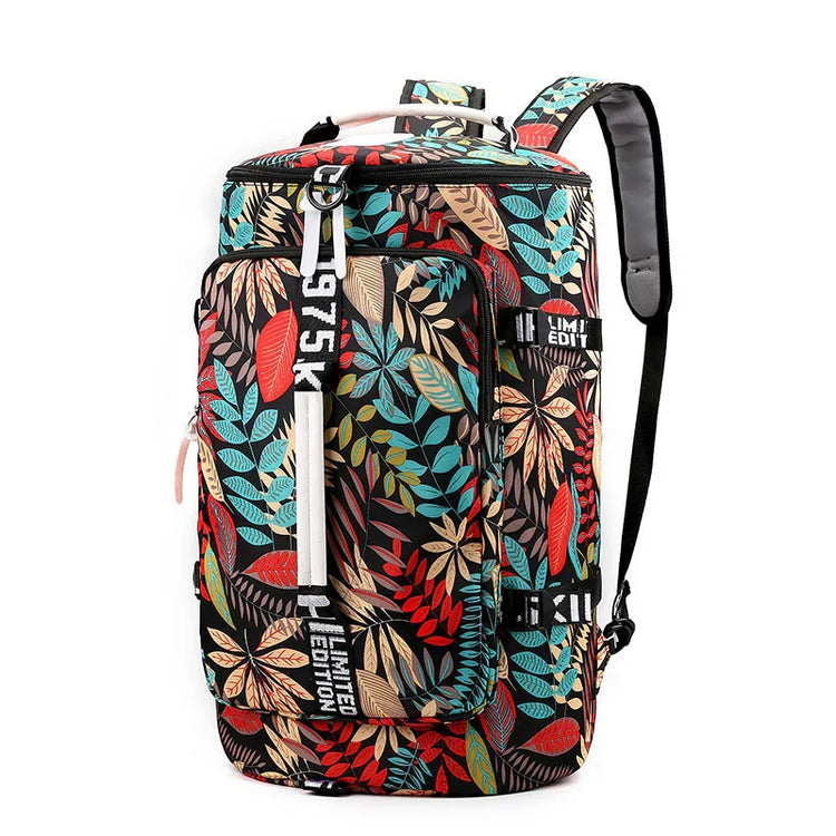Colorful leaf print backpack with black, red, blue, and beige pattern, large front pocket, adjustable straps