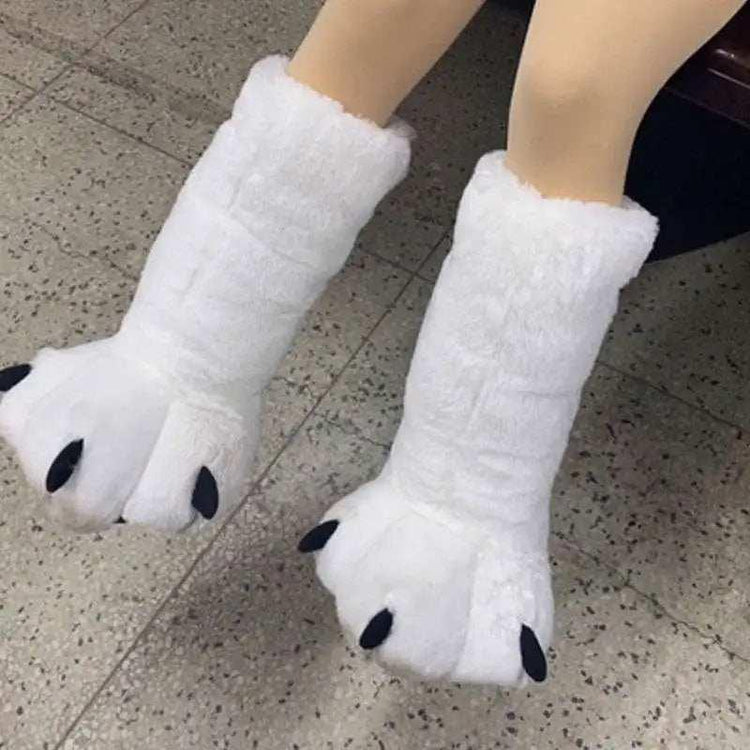 White plush animal paw slippers with black claw details, thick cozy material, oversized fit