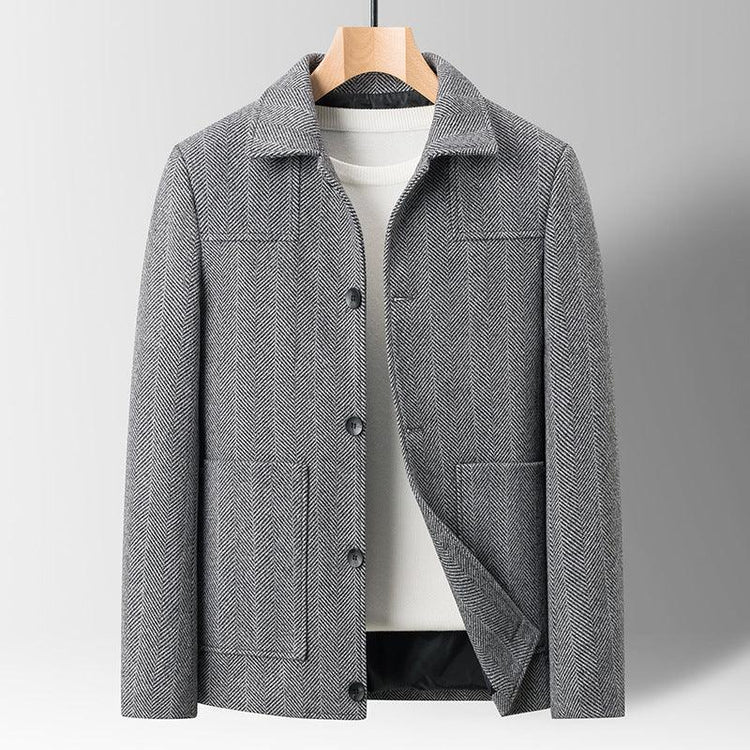 Gray herringbone wool jacket with a regular fit and button closure, displayed on a hanger