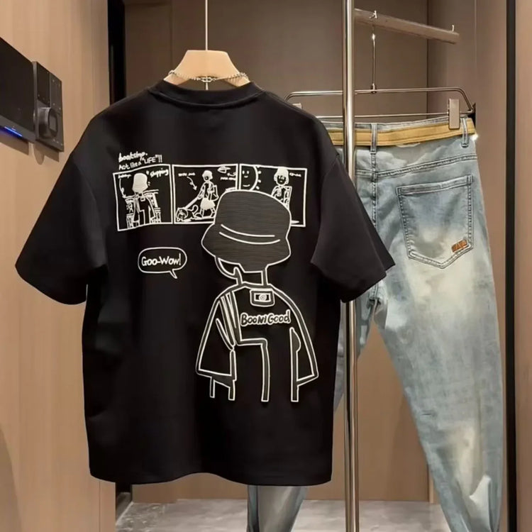 Black oversized graphic streetwear t-shirt with comic print, paired with light washed jeans.
