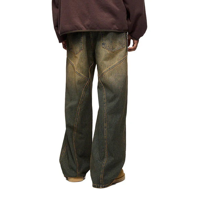 Back view of wide-leg denim jeans in faded blue with contrast stitching and relaxed fit.