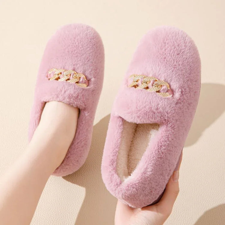 Plush pink fuzzy slippers with gold chain accent, closed toe, cozy fit, soft material