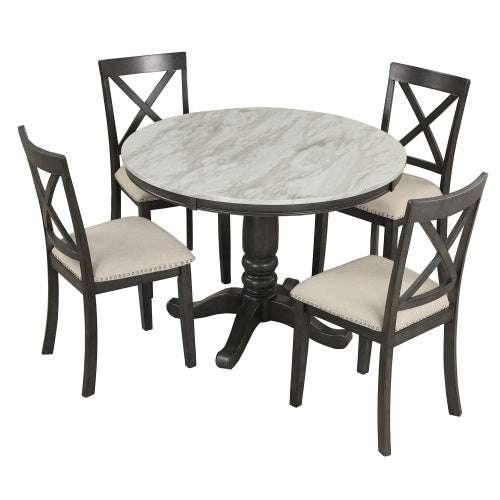Round marble-top dining table with dark wooden base and four upholstered chairs