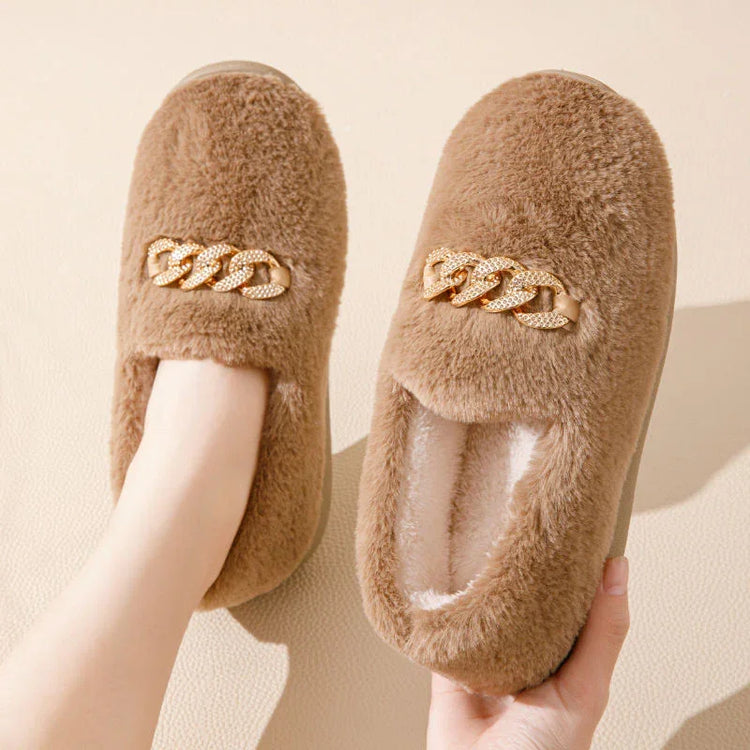 Brown plush faux fur slippers with gold chain detail, cozy closed-toe slip-on style
