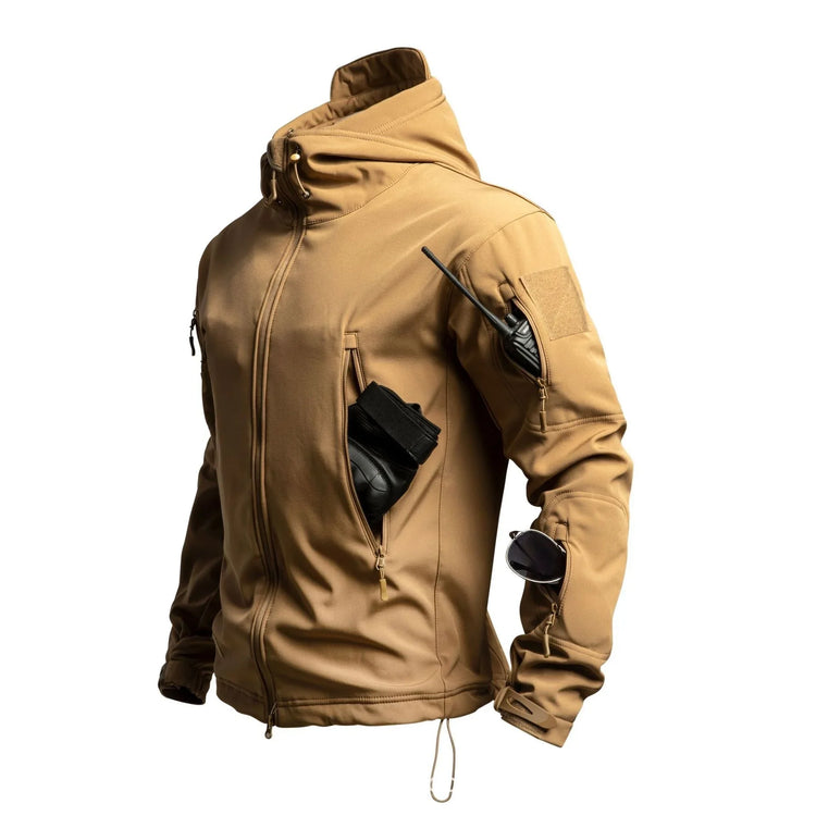 Tan tactical softshell jacket with zip pockets, hood, and slim modern fit, displayed on mannequin
