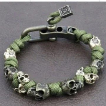 Green paracord bracelet with silver skull beads, rugged streetwear accessory, adjustable fit