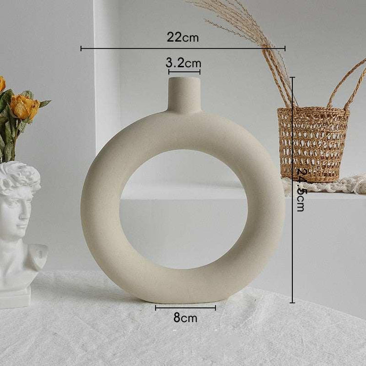 Modern beige ceramic ring vase with matte finish, circular shape, minimalistic decor, 22cm tall