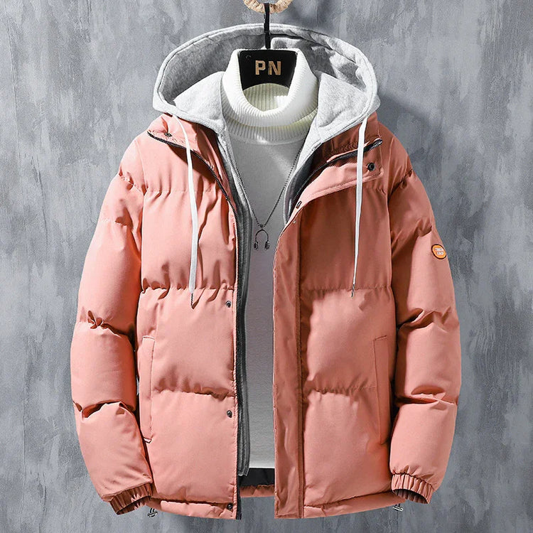 Pink puffer jacket with gray hood, zipper front, layered over white turtleneck, casual fit