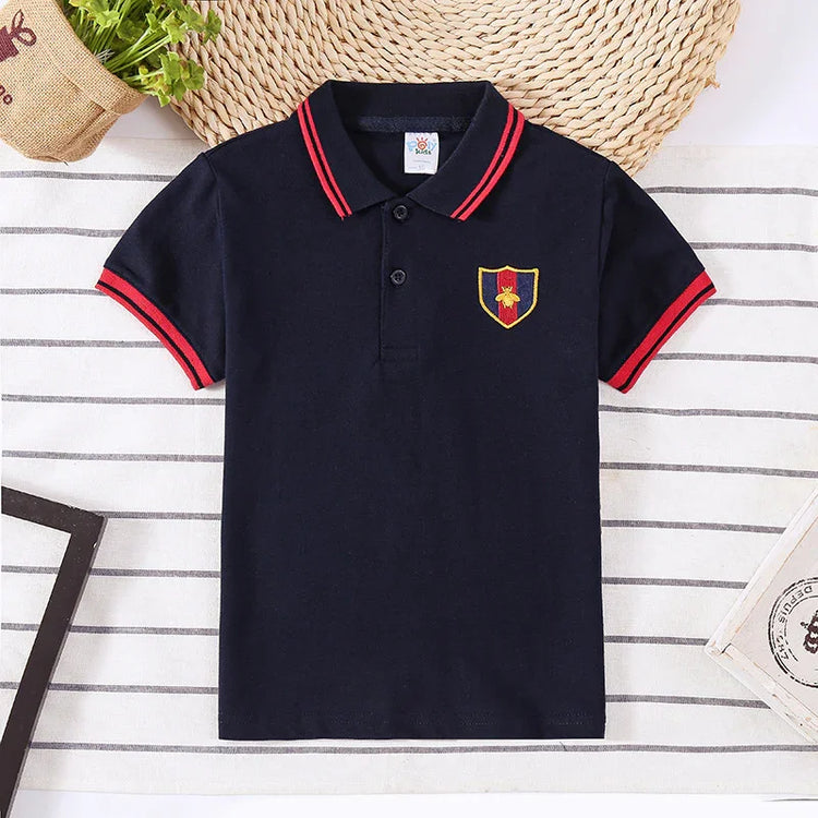 Navy blue short sleeve polo shirt with red collar stripes, patch emblem, cotton material, slim fit.