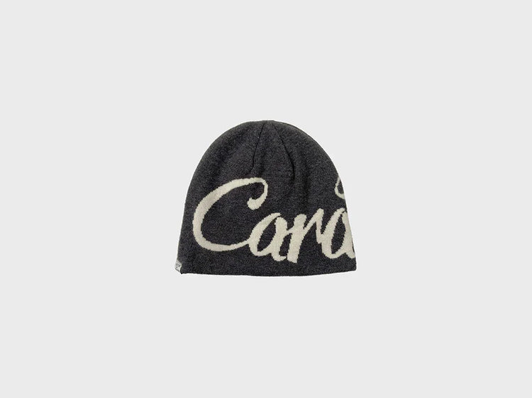 Black knit beanie with oversized white graffiti script, soft wool material, relaxed fit