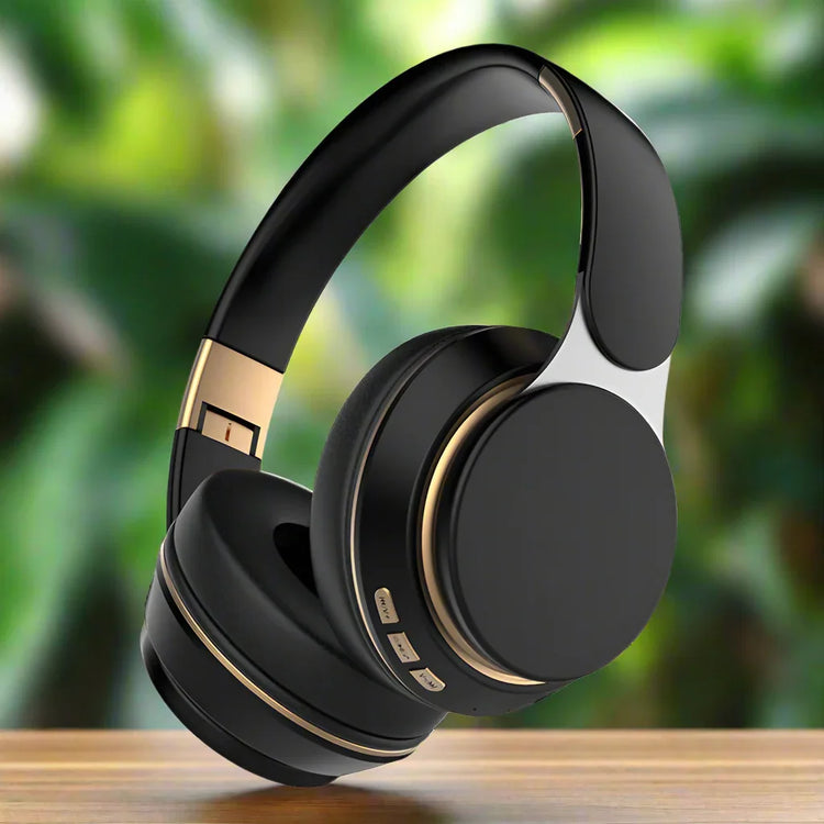 Black over-ear wireless headphones with gold accents, cushioned ear pads, modern tech accessory