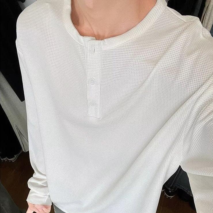 White waffle knit henley long sleeve shirt with relaxed fit and button placket